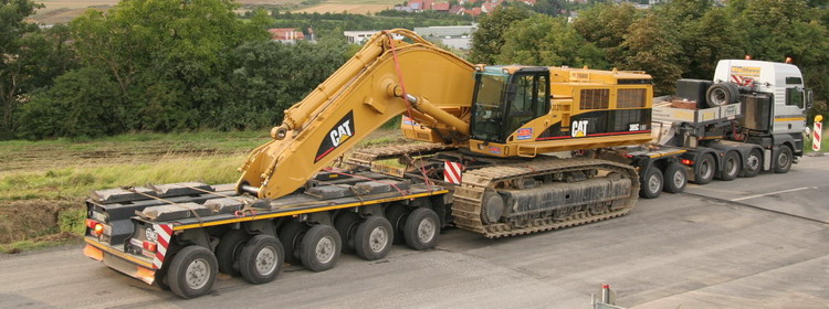 Geser MAN TGA 41.530 mit Scheuerle Tiefbettauflieger mit CAT 385